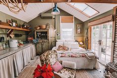 a bedroom with a bed, desk and chair in it's centerpieces