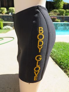 Vintage Body Glove by Robin Piccone black zipper front neoprene swim skirt, size large. Yellow Body Glove spell out text on side of skirt. Large zipper front closing. Yellow interior. Body Glove logo on skirt as well. In very good condition. No issues. Swimsuit Skirt, Yellow Interior, Body Glove, Swim Skirt, Women Swimsuits, Womens Swimwear, Front Zipper, Gloves, Take That