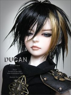 a doll with black hair and gold accents