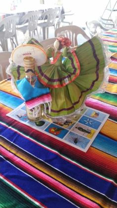 a colorful table cloth with an image of a woman holding a frisbee on it