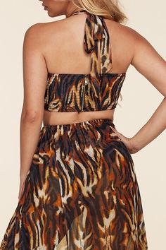 Description: Tigress Print Monokini Style Dress features an O-ring detail halter top with smocked back and assymetrical flowy skirt layer. Content: Self & Lining: 100% Polyester Model wearing size Small 𝑺𝒊𝒛𝒆 𝑪𝒉𝒂𝒓𝒕: • 2-4 Small • 6-8 Medium • 10-12 Large 𝑺𝒉𝒊𝒑𝒑𝒊𝒏𝒈 • This Item ships for free. 𝑹𝒆𝒕𝒖𝒕𝒏𝒔 • Returns (For store credit only) accepted within 30 days after your package has been delivered. 𝑪𝒂𝒏𝒄𝒆𝒍𝒍𝒂𝒕𝒊𝒐𝒏𝒔 • Can be canceled within 30 min. Summer Two-piece Tiered Skirt Dresses, Summer Two-piece Dresses With Tiered Skirt, Beach Two-piece Dress With Flowy Skirt, Two-piece Flowy Beach Dress, Spring Two-piece Halter Neck Dress, Spring Halter Neck Two-piece Dress, Flowy Halter Neck Summer Dress, Leopard Flower, Flowy Skirt