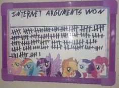 a sign that says internet arguments won with many little ponys around the board and in front of it