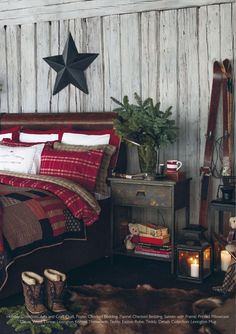 a bed room with a neatly made bed and a star on the wall