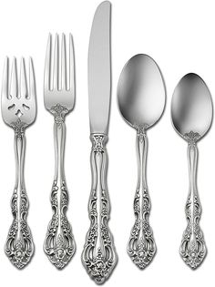 an assortment of silverware including forks, knives and spoons with filigreens