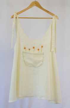 This is a 100% linen mini dress. It fits a bit bigger so you have a loosen fit. It's elegant and comfortable. I design and confection all of my products. I love making comfortable, fresh looking every ocassion women's clothing. I use natural fabrics. Spring Sundress With Pockets For Summer, Summer Sundress With Pockets For Spring, Summer Cotton Dress With Pockets, Spring Linen Dress With Slip Pockets For Daywear, Cotton Sundress With Pockets For Vacation, Casual Embroidered Linen Dress, Spring Linen Beach Dress With Pockets, Cotton Linen Dress With Pockets For Vacation, Cotton Beach Dress With Slip Pockets