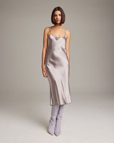 Bias cut Midi Slip Dress elegantly drapes on the body. This perfect basic can be worn for life, dressed up, or dressed down, for the perfect ensemble. Style with a sweater and boots in the Fall or wear with sandals in the Summer. 100% Silk Charmeuse Made in New York City Product Care: Dry Clean Only Sleek Silk Dress For Fall, Sleek Silk Fall Dresses, Chic Fall Party Slip Dress, Chic Slip Dress For Fall Date Night, Chic Fitted Knee-length Silk Dress, Chic Winter Silk Dresses, Chic Fitted Silk Knee-length Dress, Sleek Fitted Slip Dress For Daywear, Fall Party Slip Dress