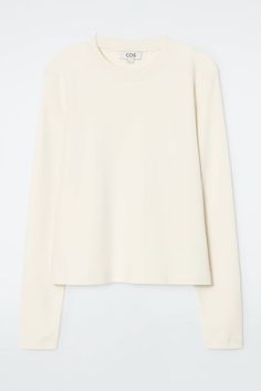 CLEAN CUT REGULAR LONG-SLEEVED T-SHIRT - Beige / undyed - T-shirts - COS Cotton Turtleneck Tops For Everyday, Classic Turtleneck Tops For Everyday, Classic Everyday Turtleneck Tops, Long Sleeve Tops With Ribbed Neckline And Relaxed Fit, Classic Long Sleeve T-shirt For Spring, Basic Top With Ribbed Neckline For Fall, Basic Cotton Turtleneck Top, Cotton Turtleneck Tops For Work, Classic Long Sleeve Fall T-shirt