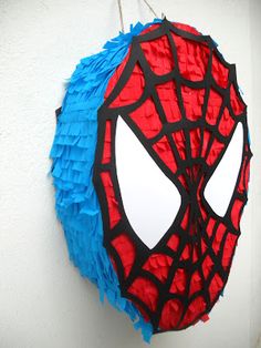 a spider man pinata hanging on the wall