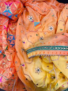 4D Peachy Orange Yellow Shaded Aari Gotta Patti Kundan Mirror Phulkari. Explore more VELVET SHAWL, DUPATTA, PHULKARI 📦 Unmatched FREE Worldwide Shipping from Canada to US, Europe, Australia, New Zealand, Norway, Belgium, Denmark, Spain, Italy, France and everywhere else. ⭐️⭐️⭐️⭐️⭐️ 5 Star Customer Reviews Gurjit, Canada ⭐️⭐️⭐️⭐️⭐️ Such an amazing experience with amazel designs I ordered payal and got it just next day. The packing and that thank you note was really wonderful. The quality and loo Semi-stitched Orange Sets With Motifs, Festive Orange Dupatta With Gota Work, Traditional Orange Salwar Kameez For Navratri, Semi-stitched Orange Saree With Mirror Work, Orange Chanderi Dupatta With Mirror Work, Festive Orange Dupatta With Mirror Work, Yellow Chanderi Choli With Motifs, Zari Work Shantoon Dupatta For Festivals, Shantoon Dupatta With Zari Work For Festivals