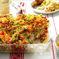 a casserole dish filled with lots of vegetables and cheese on top of it