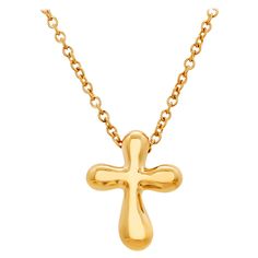 Add a touch of timeless elegance to your ensemble with this exquisite Tiffany & Co Elsa Peretti Cross Pendant Necklace. Crafted from luxurious 18 karat yellow gold, this necklace is a symbol of both faith and sophistication. The pendant features a delicate cross design, measuring 0.55 inches in length and 0.40 inches in width, making it a subtle yet striking statement piece. It is suspended from a classic 16-inch chain, creating a graceful silhouette that enhances any neckline. Authenticity is assured with the distinctive Tiffany & Co hallmark, "Tiffany & Co Au750 Peretti Spain," meticulously engraved on the pendant. With a weight of 3.4 grams, this necklace offers both substance and style, making it suitable for everyday wear or special occasions. Whether you're seeking a meaningful gift 14k Gold Cross Pendant Fine Jewelry Necklace, Fine Jewelry 14k Gold Cross Pendant Necklace, Fine Jewelry Cross Pendant Gift, Elsa Peretti Jewelry, Tiffany Cross Necklace, Tiffany Elsa Peretti Necklace, Elsa Peretti, Tiffany Jewelry, Gold Cross Pendant