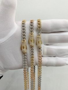 14k tricolored monaco cz chains- link style is cuban link in all gold colores - beautiful box lock system - all stones on chain are white cubic zirconias - all are 7mm thick and varies in length. 22'',24'' and 26'' long.  - 100% 14k real gold. - items are sold by piece, weight is undetermined. perfect to wear with any outfit. this style of chain can be worm with or without a pendant. pleae message us if youy have any other questions or concerns. Luxury Gold Chain Necklace With Cubic Zirconia, Luxury Cuban Link Necklace With Cubic Zirconia, Luxury Cuban Link Chain Necklace In Cubic Zirconia, Luxury Iced Out Link Chain Necklace, Cuban Link Bracelet With Cubic Zirconia, Luxury Cuban Link Necklace With Diamond Accents, Luxury Cuban Link Chain Necklace With Cubic Zirconia, Luxury Cuban Link Chain Necklace With Diamond Accents, Luxury Cuban Link Necklace