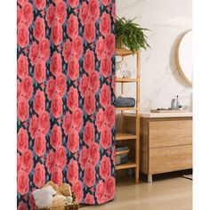 a shower curtain with red roses on it