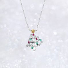 Christmas Tree Necklace with Ruby, Diamond and Emerald crafted in 14K White gold and 925S sterling silver. The pendant represents the shining Christmas Tree during the Christmas Season. Delicate Silver Christmas Tree Necklace is the perfect gift for celebrating Xmas. F E A T U R E S [Made to Order] Gold KT: 925 Sterling Silver Choice of Gold Color: Gold Vermeil in 18K Rose Gold/ 18K Yellow Gold, Sterling Silver Main Stone: Lab-Grown Ruby, Round, 3 pcs Main Stone: Lab-Grown Emerald, Round, 4 pcs White Gold Christmas Tree, White Gold Christmas, Star Accessories, Christmas Tree Necklace, Picture Necklace, Gold Christmas Tree, Writing Gifts, Tree Necklace, Colorful Christmas Tree