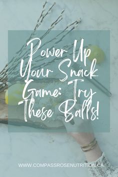 a person is holding some branches with the words power up your snack game try these balls