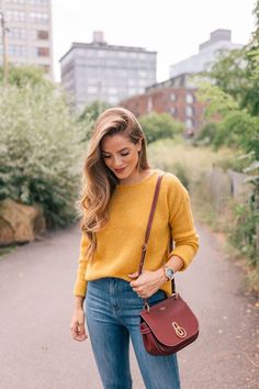 Mustard yellow sweater, high waisted jeans, saddle crossbody bag. Cute women's fashion chic fall, winter, spring, summer casual street style outfit inspiration ideas. Sweater Weather - Gal Meets Glam. Mustard Yellow Sweater, Fall Fashion Coats, Casual Chic Summer, Yellow Outfit, Pullover Outfit, Gal Meets Glam, Red Handbag, Yellow Sweater, Inspired Outfits