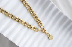 "Cuban link chain Gold plated heart padlock necklace for women. This heart necklace is perfect for yourself or for a special occasion gift. A beautiful and delicate stainless steel necklace, this is the perfect gift, it is minimalistic and adds a subtle touch and style. It is a beautiful detail that makes every romantic woman fall in love. ITEM DETAILS: Necklace Length: 17\" Necklace Weight: 3.1oz Material: Stainless Steel * JEWELRY CARE* Keep your jewelry dry. Apply makeup and hairspray before Trendy Metal Chain Necklace With Heart Pendant, Chunky Heart Pendant Chain Necklace In Metal, Chunky Heart Pendant Metal Chain Necklace, Chunky Chain Heart Pendant Necklace, Gold Plated Cuban Link Chain Necklace For Gift, Metal Charm Necklace With Chunky Chain, Trendy Curb Chain Necklace For Gift, Trendy Heart Pendant Charm Necklace With Chain, Trendy Gold Heart Pendant Chain Necklace