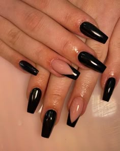 Have a look at these 40 black nail designs you can try out. These designs are made on acrylic nails but could also be done on real nails.