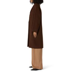 Brown wool (85% Virgin Wool, 25% Polyamide). Jacket. Long sleeves. Exposed front button closure. Pockets. 42" from shoulder to hemline. Imported. Winter Wool Outerwear For Daywear, Brown Oversized Outerwear For Formal Occasions, Brown Oversized Outerwear For Formal Events, Fall Outerwear With Hidden Button Closure For Daywear, Fall Daywear Outerwear With Hidden Button Closure, Fall Wool Outerwear For Daywear, Fall Daywear Wool Outerwear, Oversized Brown Wool Coat For Work, Lapel Collar Winter Outerwear For Daywear