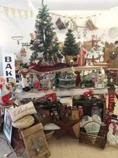 a room filled with lots of different types of christmas decorations and gifts on shelves next to each other