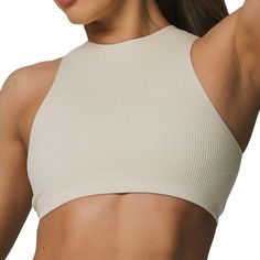 Flow Right From The Mat To Meeting Up With Friends In This Sleek, Studio-Style Cropped Active Tank. We Made It Just The Right Length To Pair Over Your Favorite High Waisted Leggings For The Ultimate Workout-To-Out And About Outfit. Full Coverage Jewel Neckline And Double Lined 2-Tier Ribbed Under Band Detail With Multi-Support Compression Levels Lici Logo Placement Center Back Fabric: Seamless 92% Nylon 8% Spandex New With Tags. In Excellent Condition. Original Price $24.00. White Ribbed Crop Top For Workout, Stretch Ribbed Tops For Relaxation, Seamless White Tops For Relaxation, Beige Seamless Workout Tops, Sports High Stretch Ribbed Crop Top, High Stretch Seamless Racerback Crop Top, Seamless High Stretch Racerback Crop Top, Fitted White Top For Relaxation, Beige Stretch Crop Top For Workout