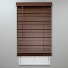 a window with brown blinds on it