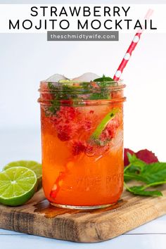 strawberry mojito cocktail in a mason jar with lime and mint garnish