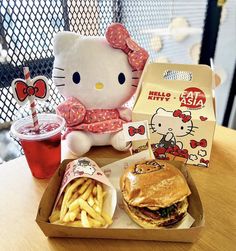 a hello kitty sandwich and fries on a table