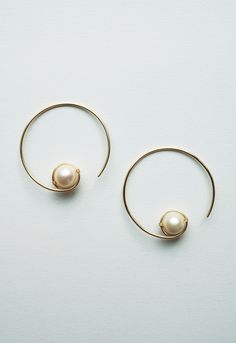 "These simple medium sized hoop earrings will become your everyday staple accessory. The Biwa saltwater pearls add a special classy touch. Handmade Gold filled or sterling silver wire Genuine semi-precious cultured Biwa pearls Size: 1-3/8\"L x 1-3/8\"W Please Note: Due to the natural state of pearls used by Brave Chick, each piece will vary. The naturally occurring variations such as shape, color, shading, color concentration, thickness, texture, are to be expected. These differences and variati Elegant Hypoallergenic Open Circle Hoop Earrings, Minimalist Hoop Pearl Earrings With Ear Wire, Elegant Open Circle Earrings With Ear Wire, Minimalist Rose Gold Round Pearl Earrings, Elegant Wire Wrapped Hoop Earrings, Elegant Wire Wrapped Round Hoop Earrings, Minimalist Pearl Hoop Earrings, Color Shading, Biwa Pearls