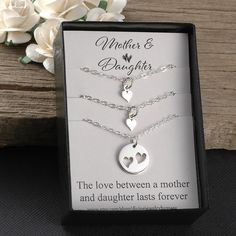 "A Beautiful sterling silver heart necklace set for mother and daughters. Two necklaces come with a tiny heart that fits perfectly inside of the larger heart cut-out circle necklace. This comes with a 14\", 16\", 18\", or 20\" sterling silver flat cable chain. Please convo me for a quote on a longer chain. To add birthstones to this set, you can choose from one of these listings: https://www.etsy.com/shop/DivineJewelrybyMary?section_id=15353062&ref=shopsection_leftnav_4 I also have a tiny in Sterling Silver Charm Necklace For Mother's Day, Personalized Silver Charm Necklace For Mother's Day, Silver Charm Necklace For Anniversary On Mother's Day, Silver Charm Necklaces For Mother's Day Anniversary, Mother's Day Silver Charm Necklace, Silver Heart Necklace For Mother's Day, Nickel Free, Dainty Silver Jewelry Gift For Mom, Dainty Silver Jewelry For Mom, Silver Nickel-free Heart Necklace For Mother's Day