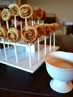 there are many rolls on the stick and a cup of coffee