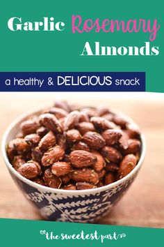 garlic rosemary almonds in a blue and white bowl with the title garlic rosemary almonds