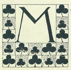 an image of four leaf clovers with the letter m in it's center