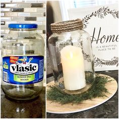 a candle is sitting in a glass jar on a plate next to a sign that says plastic