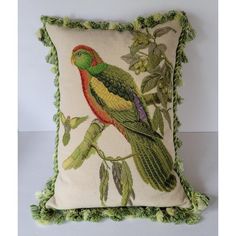 a decorative pillow with a parrot on it