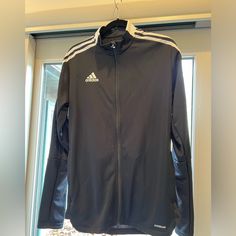 Adidas Men’s Soccer Jacket. Never Worn. Perfect For Spring Practice And Games. Black Adidas Functional Windbreaker, Adidas Black Sports Track Jacket, Adidas Black Track Jacket For Sports, Adidas Black Sportswear Outerwear, Adidas Functional Black Track Jacket, Functional Adidas Black Track Jacket, Adidas Black Track Jacket For Outdoor Activities, Adidas Black Sports Windbreaker, Adidas Black Sports Outerwear