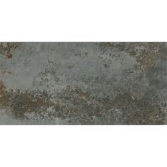 an old, dirty concrete wall with some rust on it's sides and brown spots