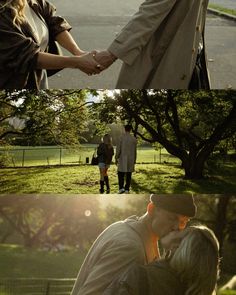 two people are holding hands and walking in the park, one is kissing the other