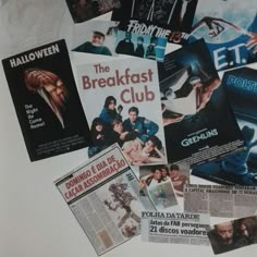 several movie posters are laying on top of each other, including one for the breakfast club