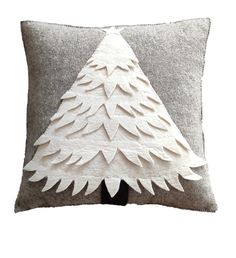 a decorative pillow with a white christmas tree on the front and grey back, made out of felt