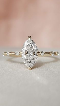 an oval cut diamond engagement ring with side stones