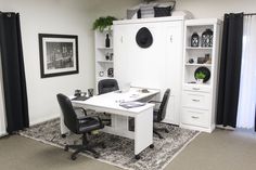 an office with black and white decor in the corner, including a bookcase, chair, desk, and bookshelf