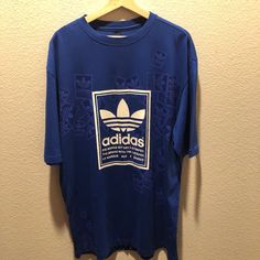 Great Condition! Never Worn. No Trade. Ship The Same Or Next Day. Bundle And Save :) All Items Ship From A Smoke Free Home. Adidas Blue Tops For Spring, Adidas Casual Shirt For Spring, Casual Adidas Shirt For Spring, Adidas Casual Streetwear Shirt, Spring Adidas Blue Tops, Adidas Blue Tops With Graphic Print, Adidas Oversized Crew Neck Top, Oversized Blue Shirt With Letter Print, Oversized Blue Shirt With Screen Print