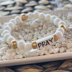 Affirmation bracelets featuring a hand-lettered affirmation focal bead and our abstract print beads and gold logo charm. Stretchy to fit most wrists. Inspirational Adjustable White Name Bracelet, Inspirational White Adjustable Name Bracelet, Meaningful Adjustable White Name Bracelet, Inspirational White Bracelets For Friendship, Inspirational White Bracelet Jewelry, Inspirational White Stretch Bracelet Gift, Meaningful White Adjustable Beaded Bracelets, Inspirational White Round Bead Jewelry, Inspirational White Bracelet With 8mm Beads