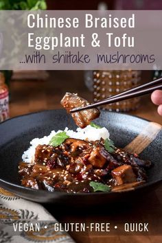 chinese braised eggplant and tofu with shiitake mushrooms in a black bowl