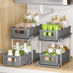 three gray baskets with soaps, lotions and hand sanitizers in them