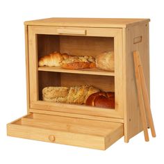 a wooden display case with breads and pastries in it on top of a white background