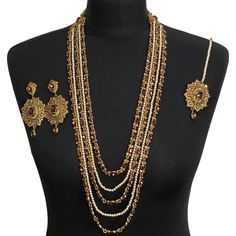 Jewellery set includes-  Diamonte layered mala Tikka Earings Gold Bridal Sets With Stone Work For Celebration, Bollywood Necklaces With Latkans For Wedding, Bollywood Style Necklaces With Latkans For Wedding, Bollywood Style Necklace With Latkans For Wedding, Bollywood Style Wedding Necklaces With Latkans, Bollywood Style Gold Jewelry With Stone Work, Latkans Jewelry For Wedding And Diwali, Bollywood Style Jewelry With Latkans For Wedding, Elegant Gold Mala For Ceremonial Use