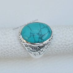 Gemstone-Turquoise Shape-Oval Metal-925 Sterling Silver This One of a kind ring is adorned with beautiful Turquoise gemstone in sterling silver. Turquoise is the birthstone representing the month of December. About gemstone-Turquoise is the stone of peace that decreases tension,nervousness,tension and stress. It is believed to protect from negativity .It is the stone of clear communication and restores clear vision to the mind. Turquoise is associated with luck,success,ambition and creativity. I Turquoise Natural Stones Oval Rings, Turquoise Oval Rings With Natural Stones, Oval Turquoise Rings With Natural Stones, Turquoise Oval Ring With Large Stone, Silver Oval Turquoise Ring With Natural Stones, Turquoise Gemstone Rings With Oval Cabochon, Turquoise Gemstone Rings In Oval Cabochon Shape, Turquoise Oval Cabochon Gemstone Ring, Classic Oval Turquoise Gemstone Ring