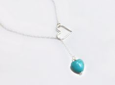 "Turquoise Heart Clasp-less Lariat Necklace Dainty and sweet ~ the small turquoise heart and larger open heart loop are a match made in heaven. The perfect gift for your sweetie! *See important measuring instructions below - A gorgeous and bright turquoise magnesite heart shaped stone measures 10mm - Chain is a shimmery and light 14k gold fill, rose gold fill or 925 sterling chain - Heart pendant is either sterling silver, rose gold fill or 14k gold fill and measures 15mm - Total length of neckl Adjustable Turquoise Heart Pendant Jewelry, Turquoise Lariat Necklace Gift, Turquoise Lariat Necklace As A Gift, Sterling Silver Lariat Turquoise Necklace Gift, Turquoise Heart-shaped Wedding Jewelry, Turquoise Heart Wedding Jewelry, Handmade Turquoise Lariat Necklace Gift, Turquoise Heart Necklace, Small Heart Necklace